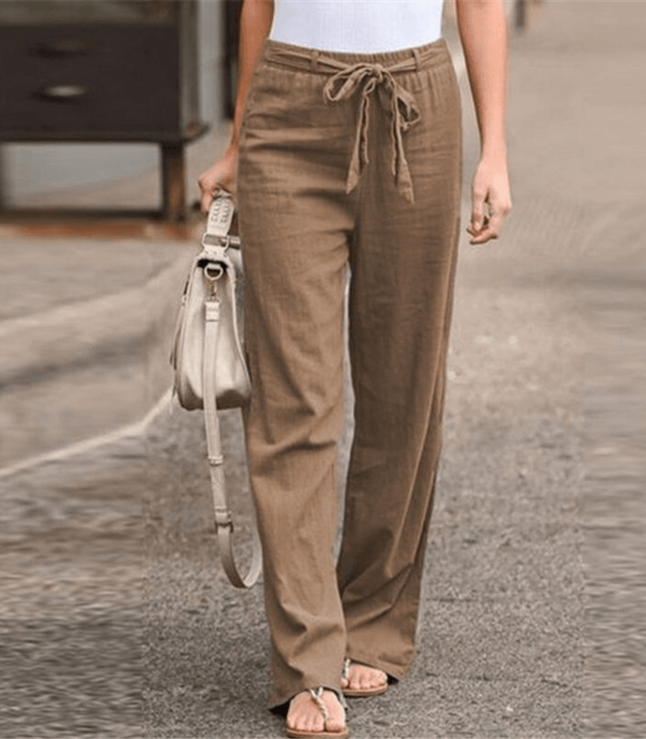 Woman wearing relaxed drawcord-waist pants with a smart top, out for the day.