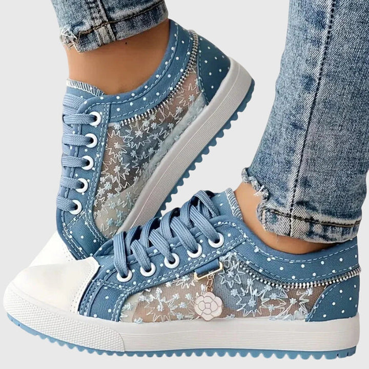 A woman walking comfortably in blue cushioned orthopaedic sneakers