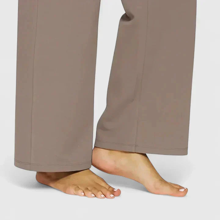 A woman in elegant straight-leg pants with pockets, styled for a polished everyday look.