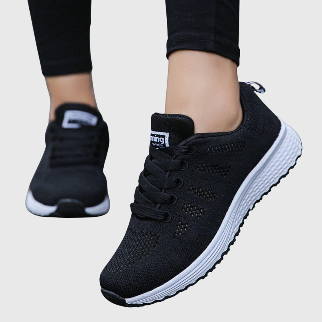 A woman enjoying a gentle stroll in cushioned orthopaedic comfort shoes.