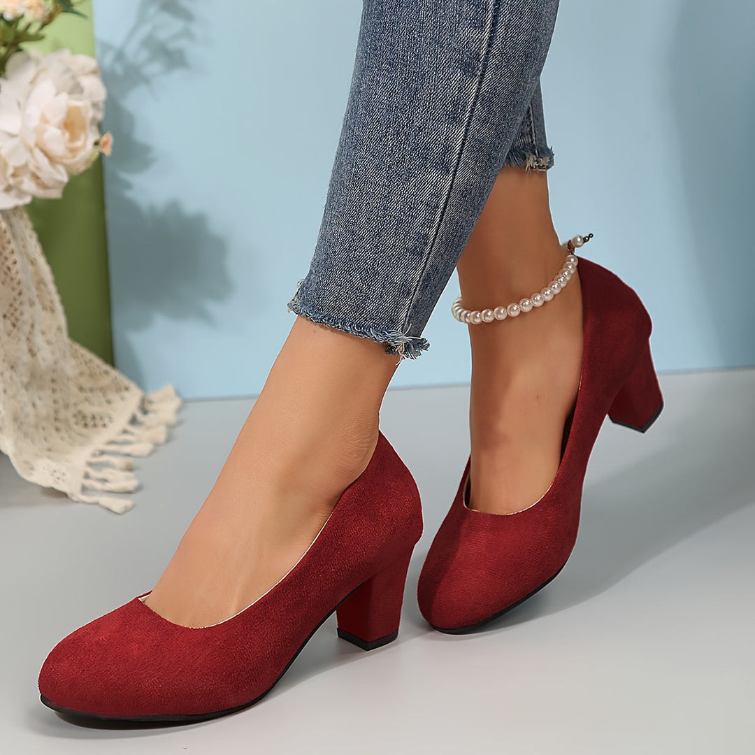 A woman in sturdy block heels standing comfortably and confidently through a long day.