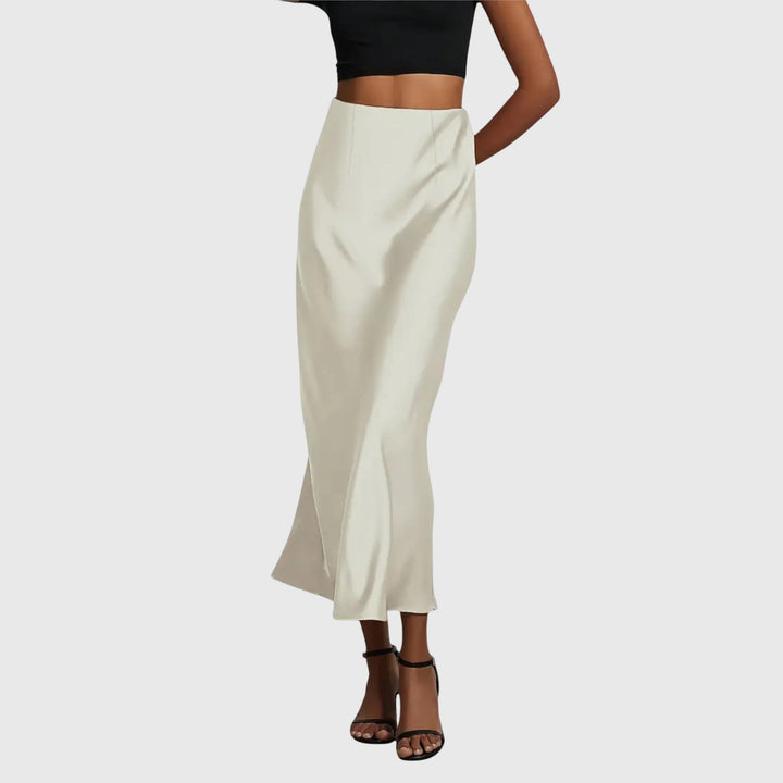 A woman in a fitted fishtail skirt with a flared hem, styled elegantly for a special occasion.