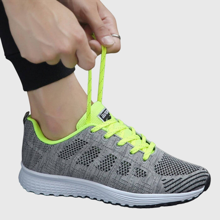 A woman enjoying a gentle stroll in cushioned orthopaedic comfort shoes.