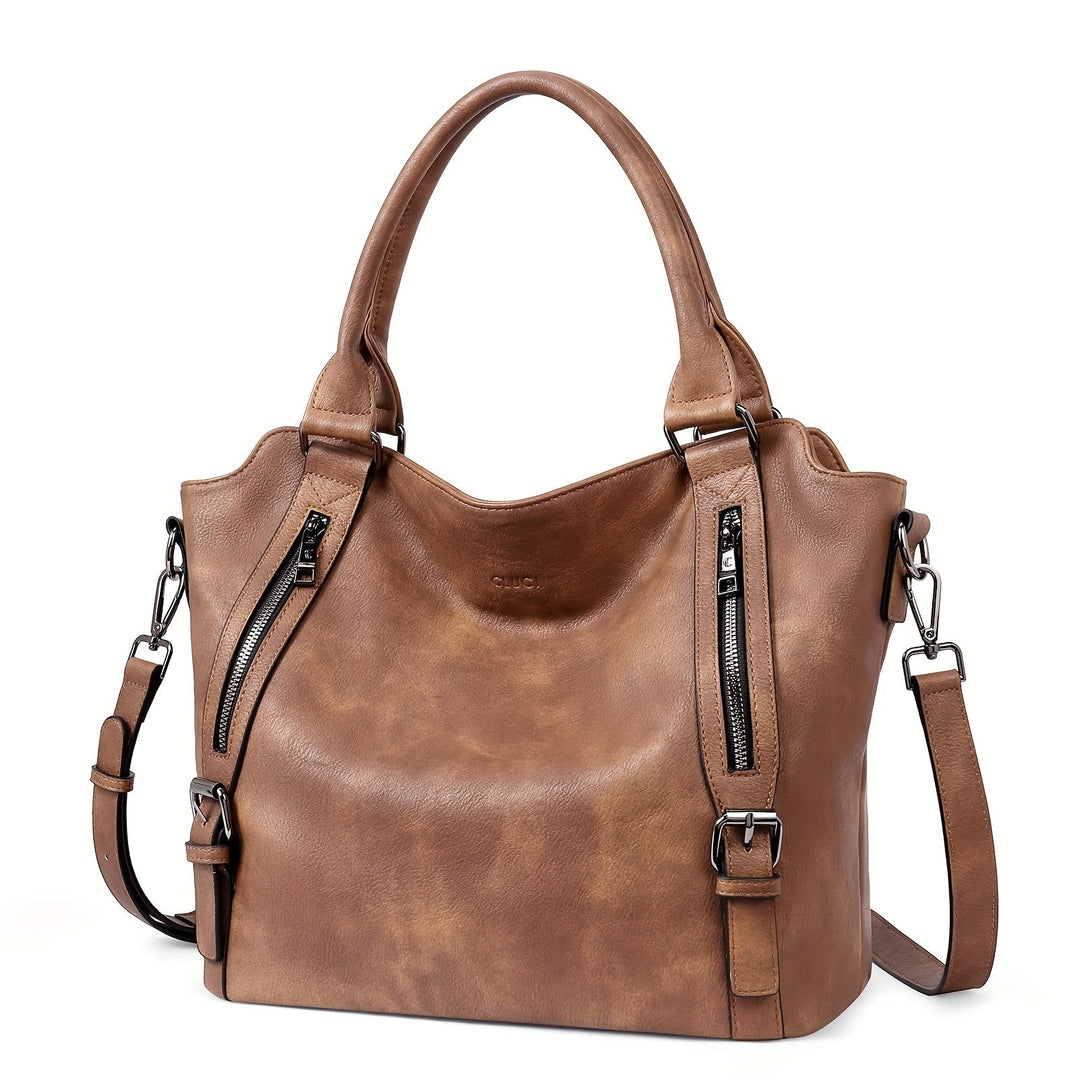 A woman wearing a roomy shoulder bag across her body while out running errands.