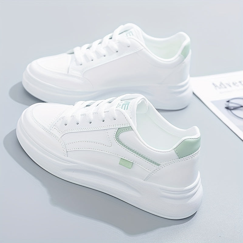 A woman in crisp white light comfort sneakers paired with jeans.