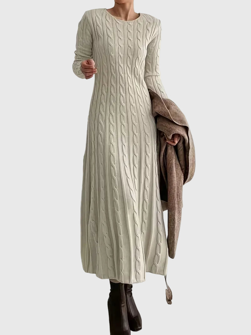 Woman wearing the Emily cable-texture maxi dress in soft cream, styled with boots.
