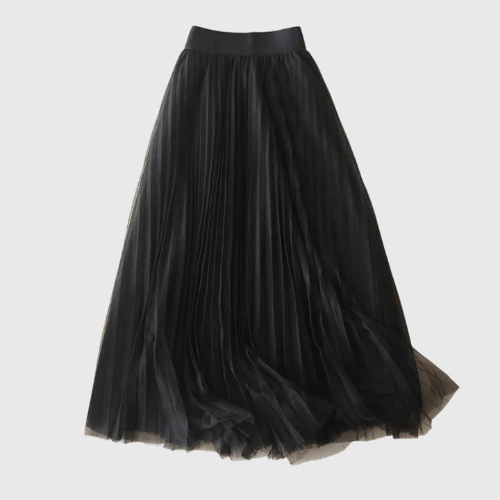A woman in a flowing layered flared skirt, styled elegantly for a special day-to-night look.