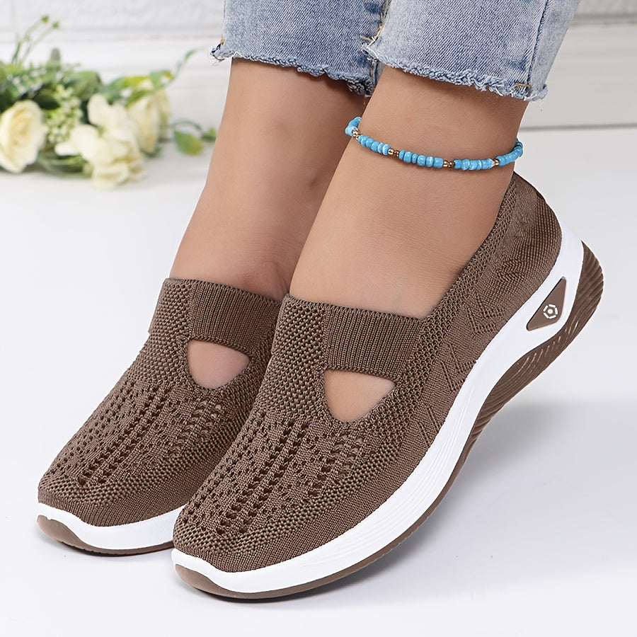 A woman stepping into easy slip-on comfort sneakers with no laces.