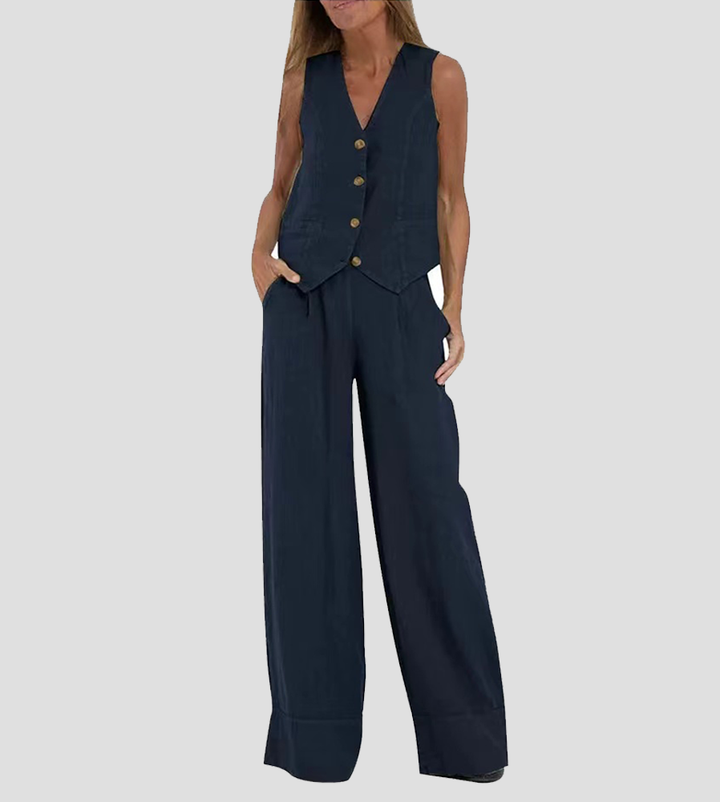 A woman wearing a tailored waistcoat with flowing wide-leg pants