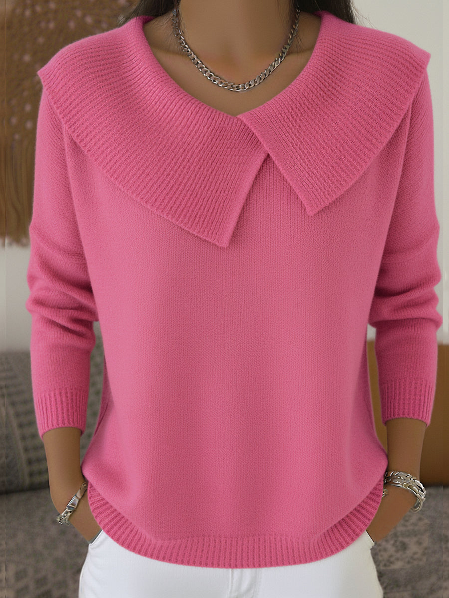 A woman wearing a soft collared sweater styled elegantly for a festive occasion.