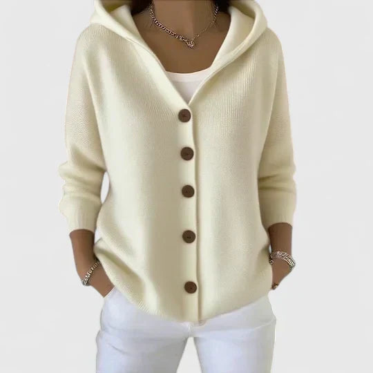 A woman wearing a hooded button cardigan open over a top for a relaxed everyday look.