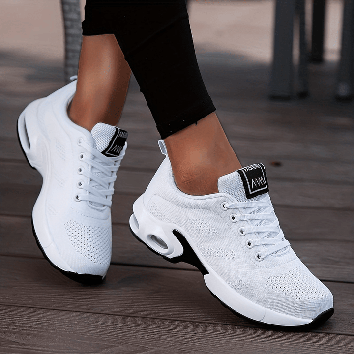 A woman walking further in breathable, air-cushioned non-slip sneakers.