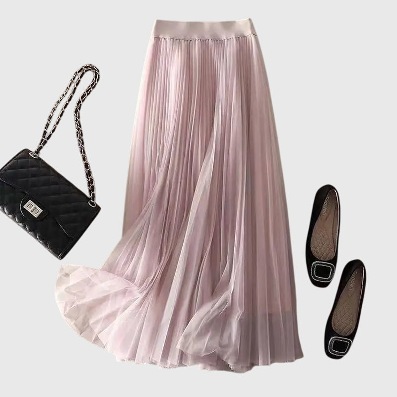 A woman in a flowing layered flared skirt, styled elegantly for a special day-to-night look.