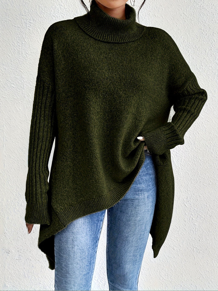 A woman wearing a stand-collar sweater with a chic asymmetric drape, warm and polished.