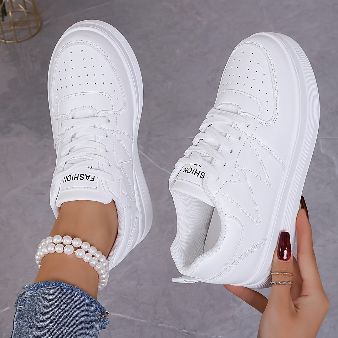 A woman wearing elegant two-tone platform sneakers in the city