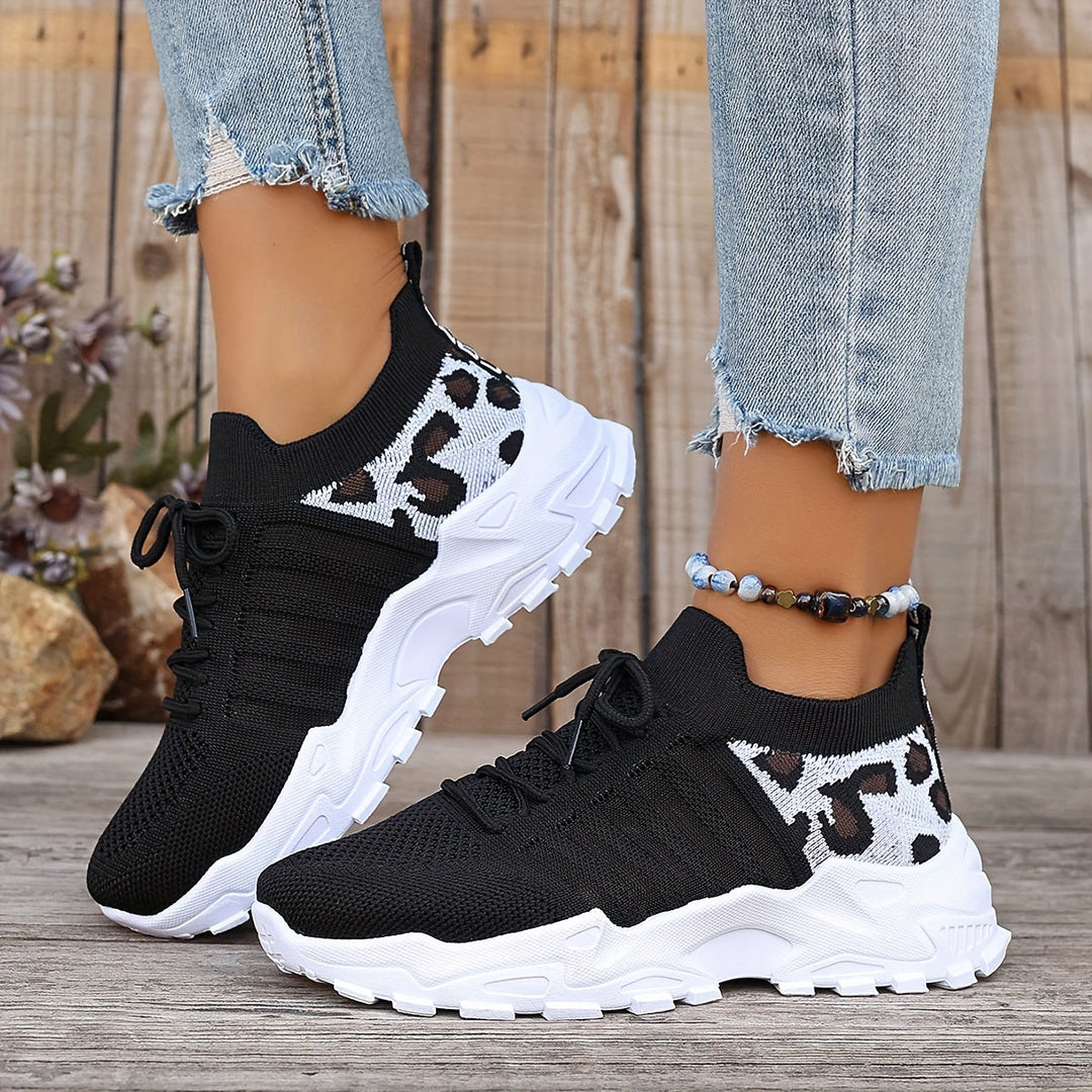 A woman walking in light, breathable comfort sneakers on a warm day.