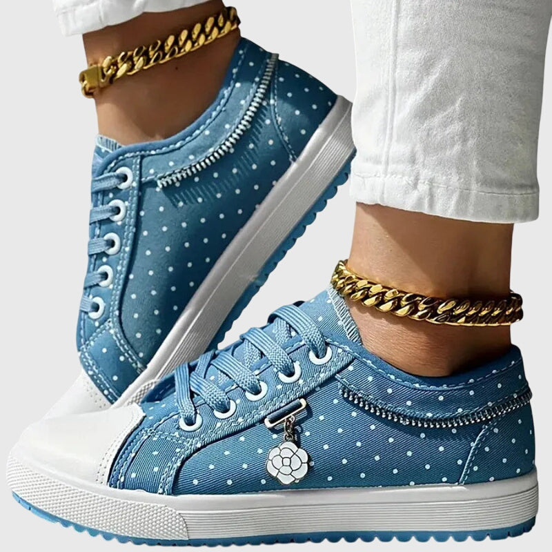 A woman walking comfortably in blue cushioned orthopaedic sneakers