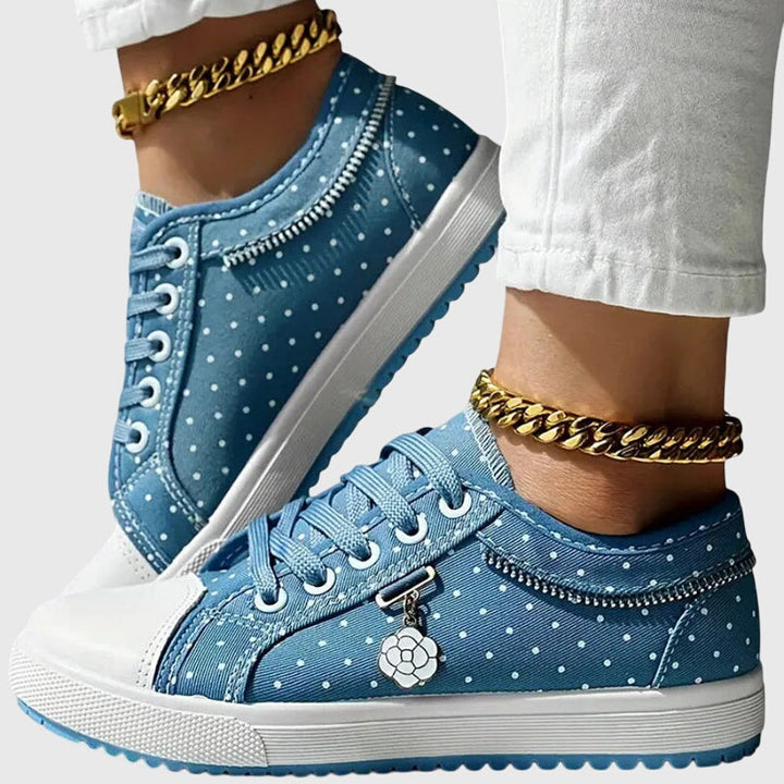A woman walking comfortably in blue cushioned orthopaedic sneakers