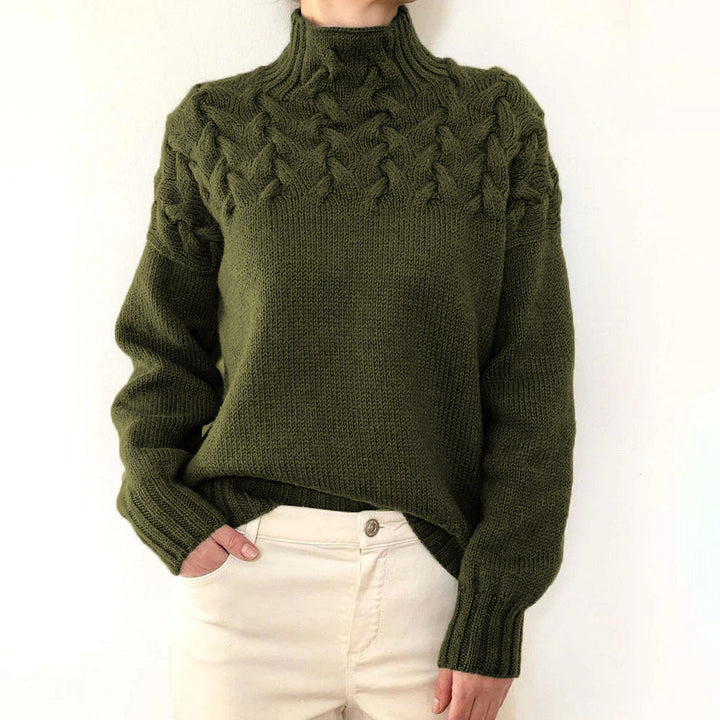 A woman wearing a warm roll-neck sweater, cosy and elegant on a cold winter day.