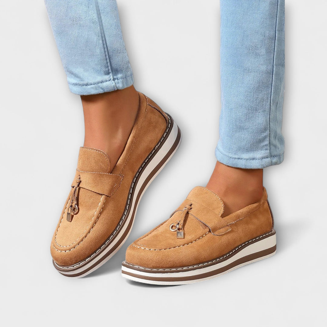 A woman wearing soft round-toe casual loafers with a relaxed everyday outfit