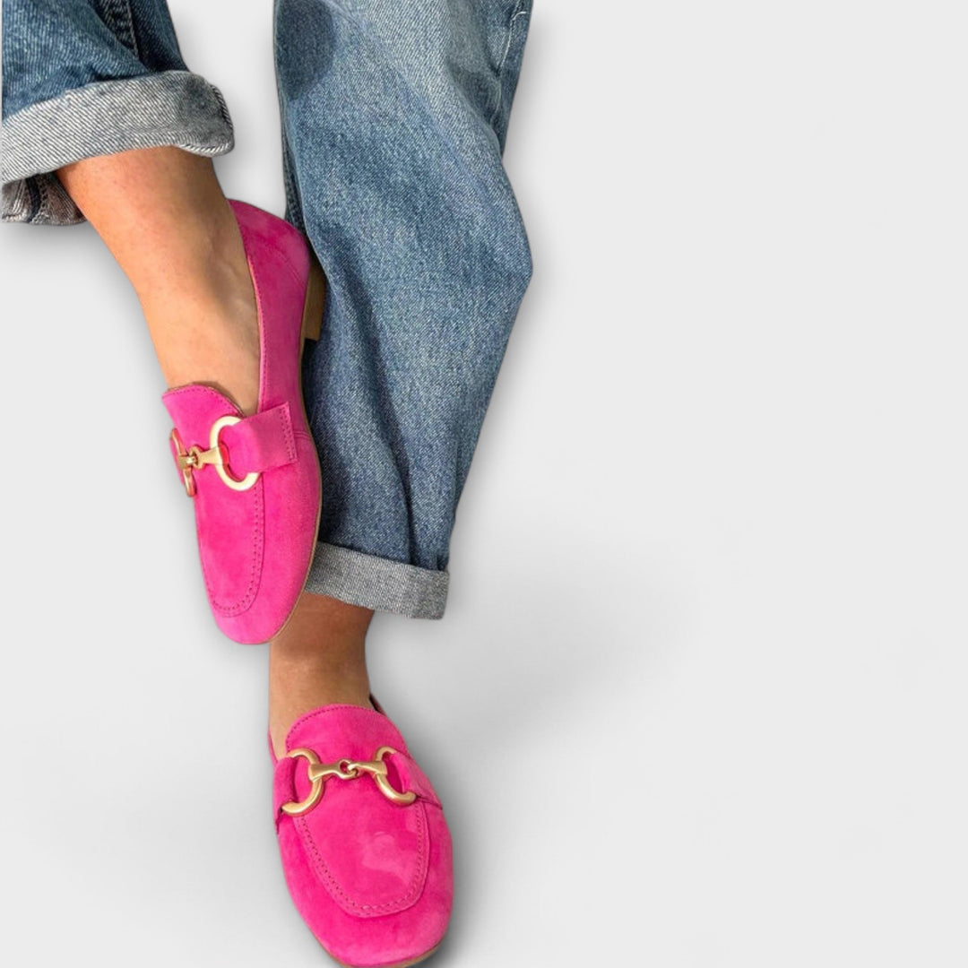 A woman stepping out in soft slip-on moccasin loafers with a relaxed everyday outfit