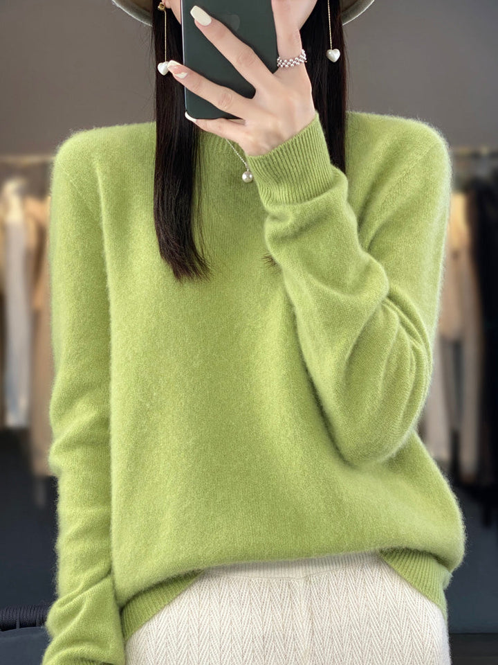 A woman wearing a super-soft warm sweater, relaxed and cosy on a chilly day.