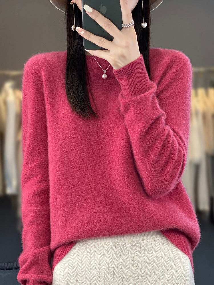 A woman wearing a super-soft warm sweater, relaxed and cosy on a chilly day.