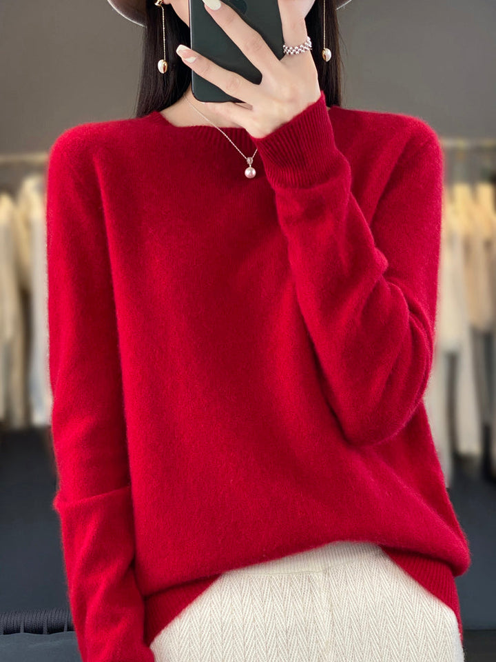 A woman wearing a super-soft warm sweater, relaxed and cosy on a chilly day.