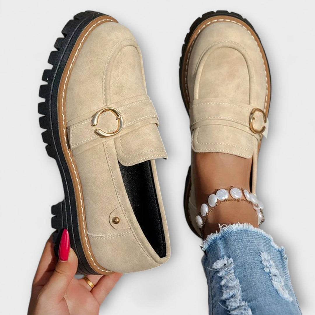 A woman wearing soft round-toe loafers with a casual everyday outfit