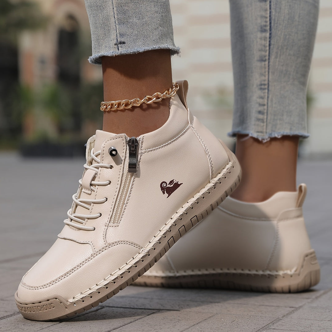 A woman standing comfortably in wide-fit therapeutic comfort shoes
