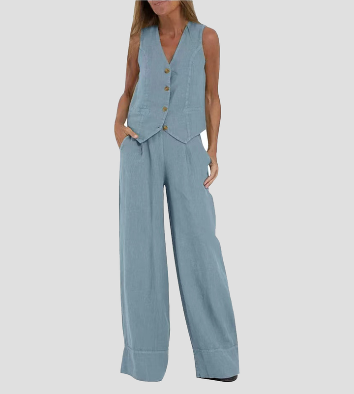 A woman wearing a tailored waistcoat with flowing wide-leg pants