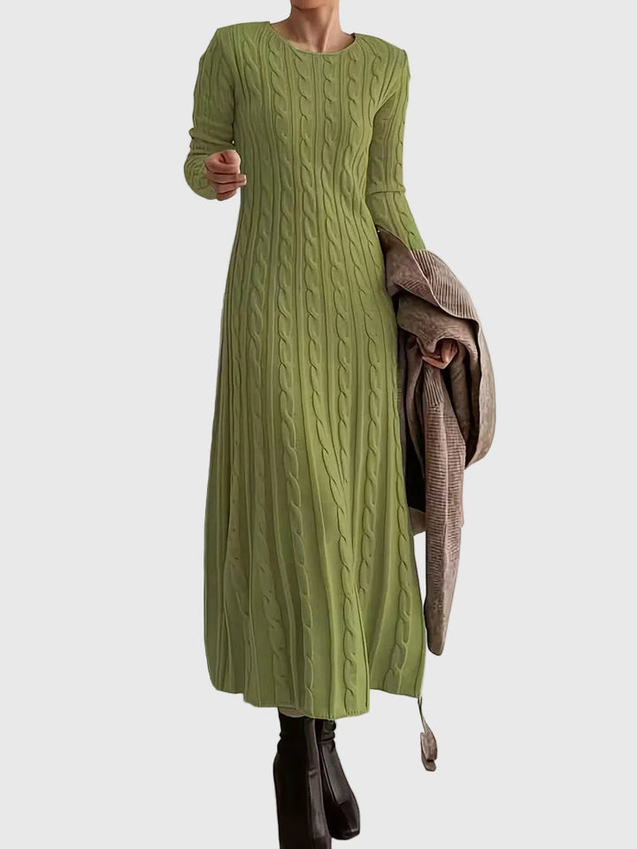 Woman wearing the Emily cable-texture maxi dress in soft cream, styled with boots.
