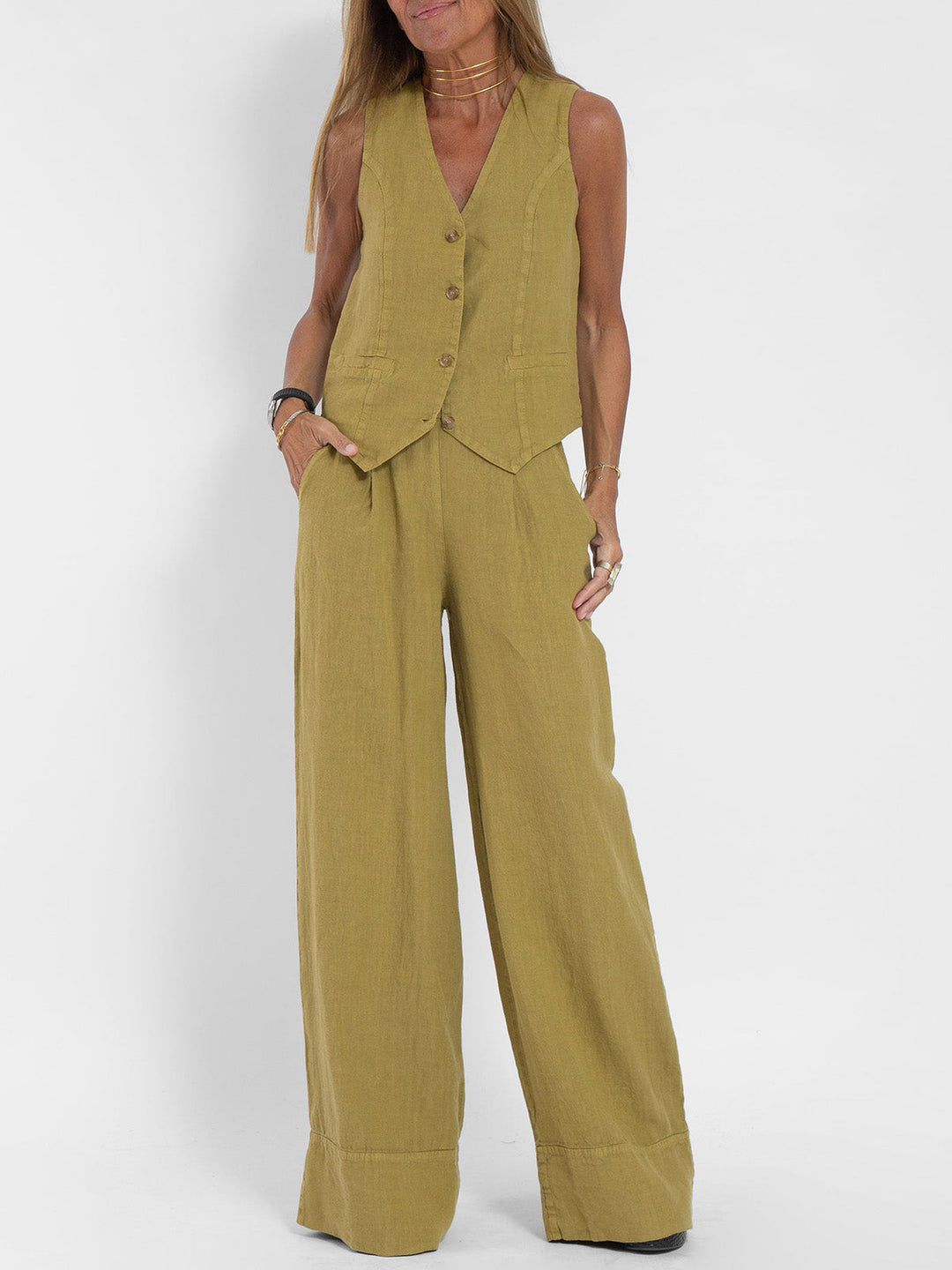 A woman wearing a tailored waistcoat with flowing wide-leg pants