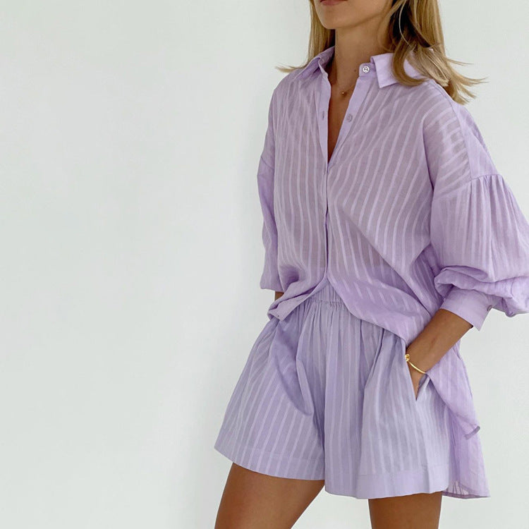 A woman wearing a button-front blouse with matching shorts