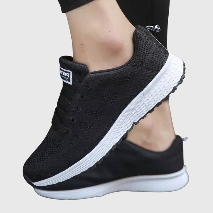 A woman enjoying a gentle stroll in cushioned orthopaedic comfort shoes.