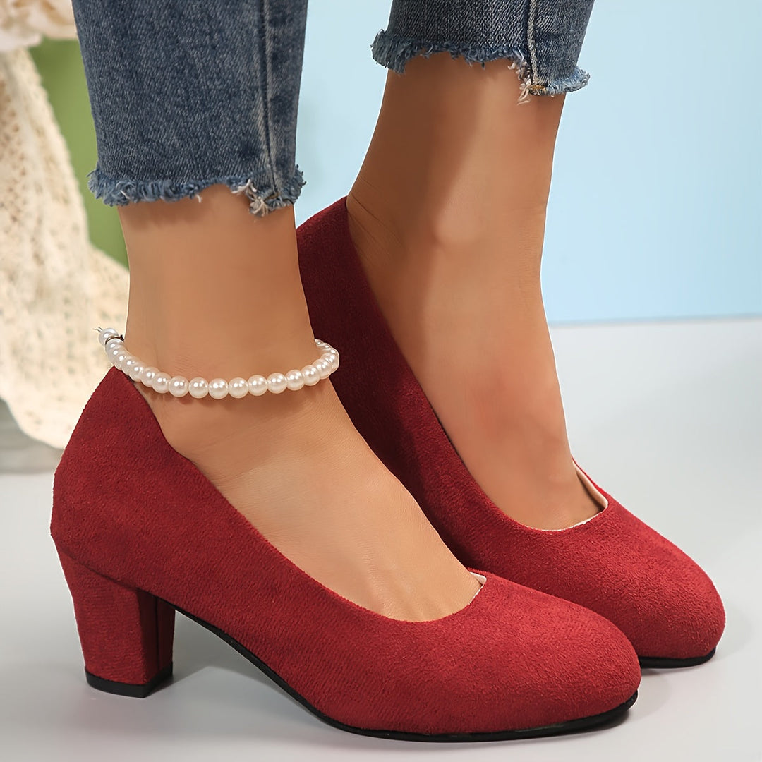 A woman in sturdy block heels standing comfortably and confidently through a long day.