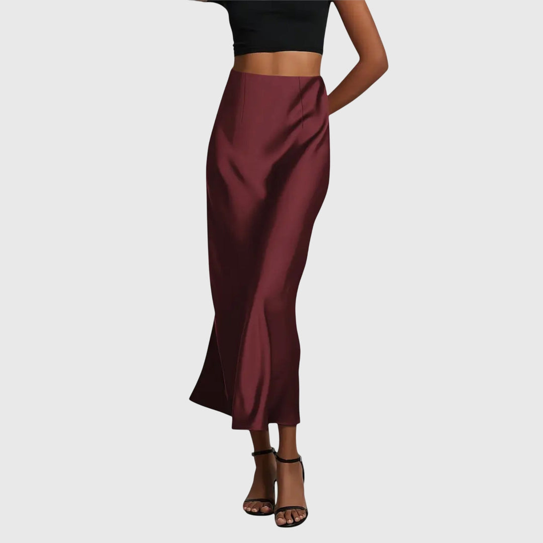 A woman in a fitted fishtail skirt with a flared hem, styled elegantly for a special occasion.