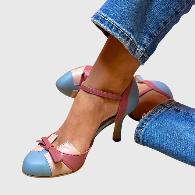 A woman wearing feminine heeled sandals with a summer occasion outfit