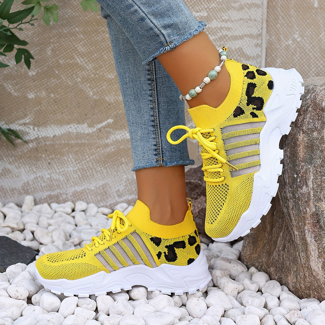 A woman walking in light, breathable comfort sneakers on a warm day.