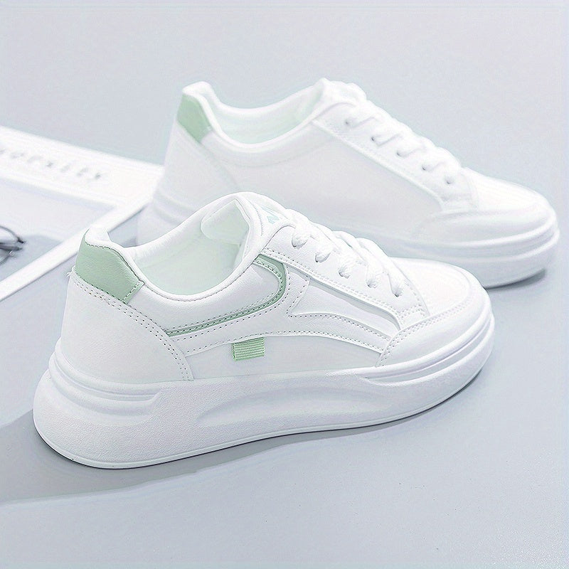 A woman in crisp white light comfort sneakers paired with jeans.