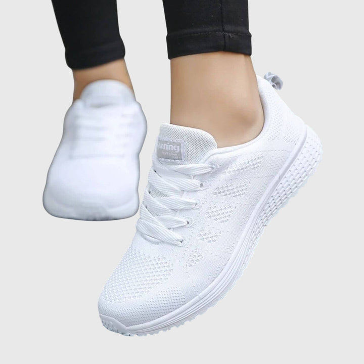 A woman enjoying a gentle stroll in cushioned orthopaedic comfort shoes.