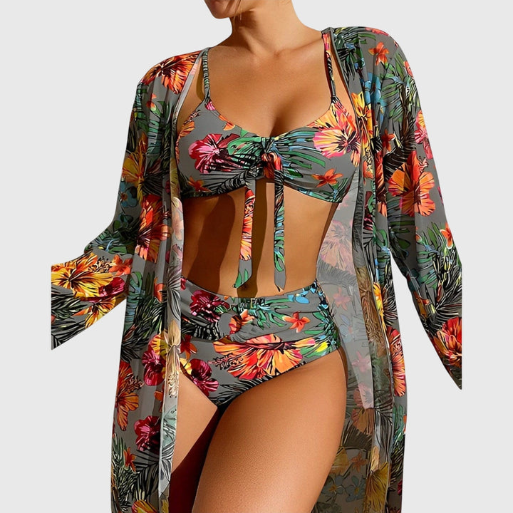 A woman by the pool in a matched printed bikini set, relaxed and confident in the summer sun.