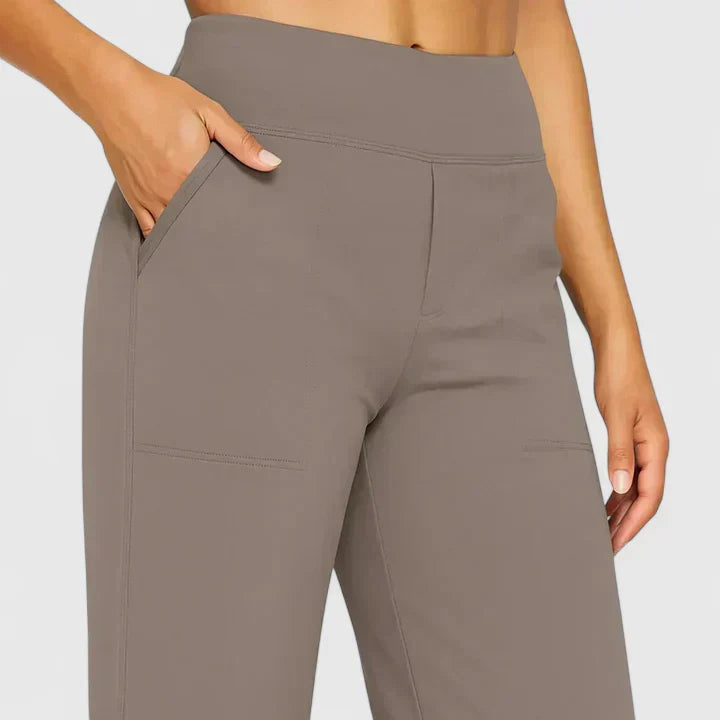 A woman in elegant straight-leg pants with pockets, styled for a polished everyday look.