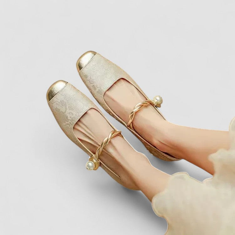 A woman in sparkling Mary Jane shoes with a low block heel at an evening celebration.