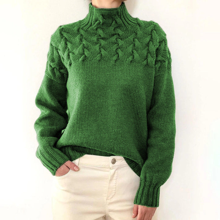 A woman wearing a warm roll-neck sweater, cosy and elegant on a cold winter day.