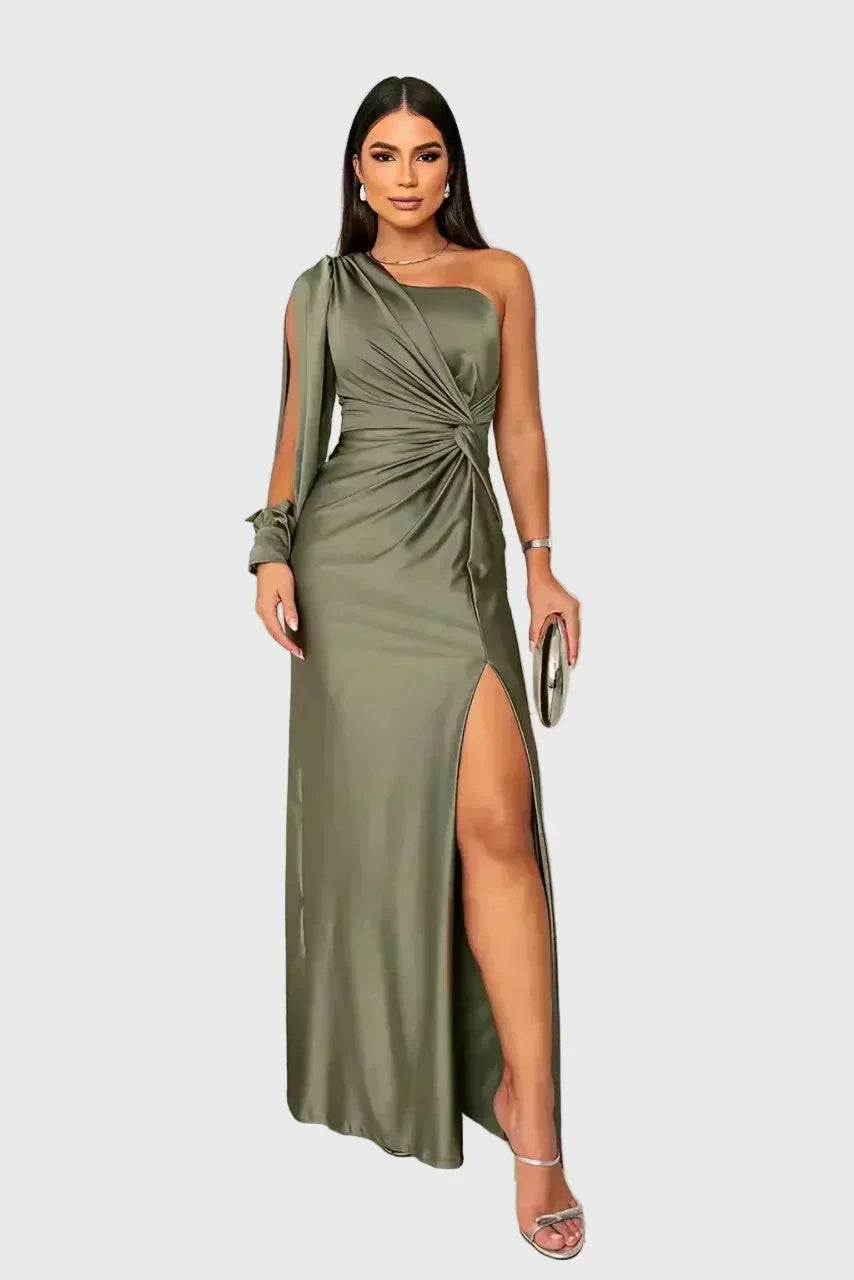 Woman wearing a long flowing evening maxi dress with elegant, graceful lines.