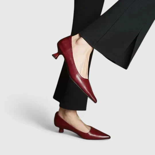 A woman in balanced comfort heels moving from the office to an evening reception.