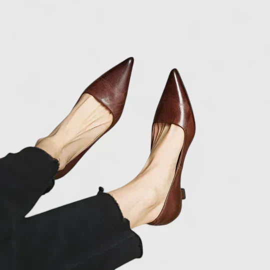 A woman in balanced comfort heels moving from the office to an evening reception.