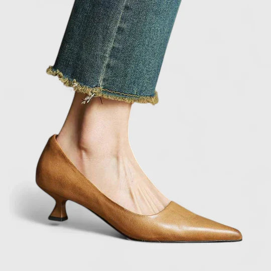 A woman in balanced comfort heels moving from the office to an evening reception.
