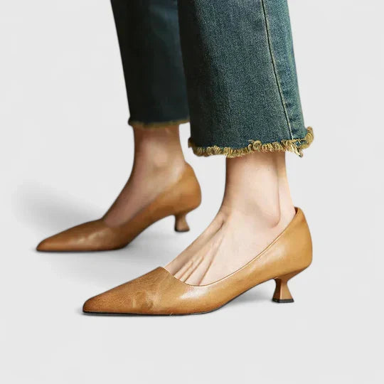 A woman in balanced comfort heels moving from the office to an evening reception.